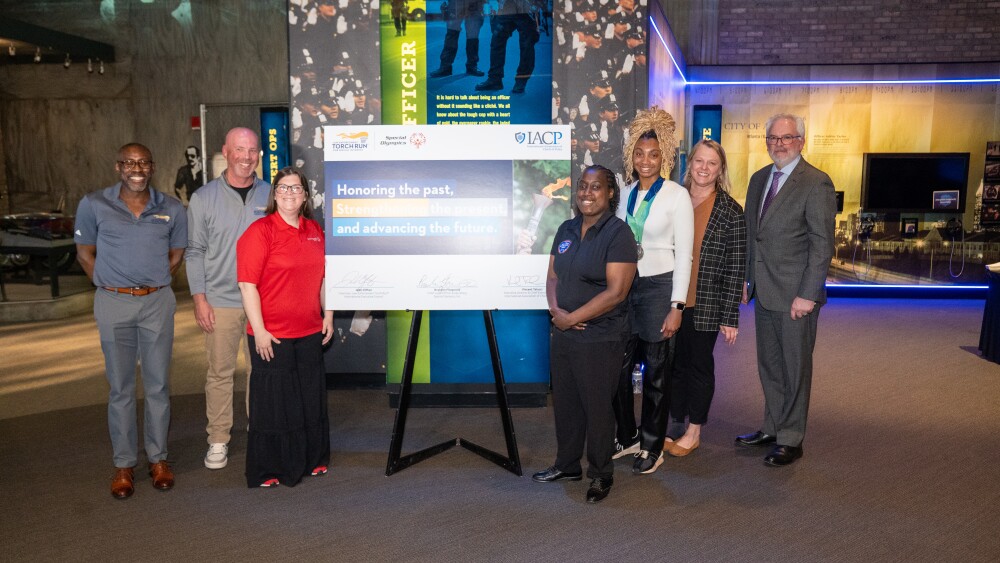 Left to right: Brandon Fitzgerald, Chief Legal Officer and Board Secretary for Special Olympics; John Clifton, Chairman of the Law Enforcement Torch Run (LETR) International Executive Council; Stephanie Price, Special Olympics Arkansas Athlete; Novie Craven, Special Olympics Washington, D.C. Athlete; Madison Gains, Special Olympics Washington, D.C. Athlete; Sandy Nash, Executive Director of the Law Enforcement Torch Run for Special Olympics; and Vincent Talucci, CEO and Executive Director of the International Association of Chiefs of Police (IACP), during the MOU signing between IACP, LETR, and Special Olympics at the National Law Enforcement Museum in April 2026.